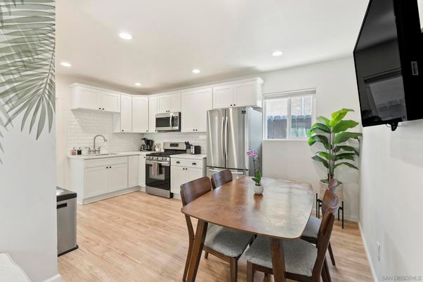 Dining room, Interior, Kitchen, Recessed Lighting, Stainless Steel Appliances, Wood Texture Flooring