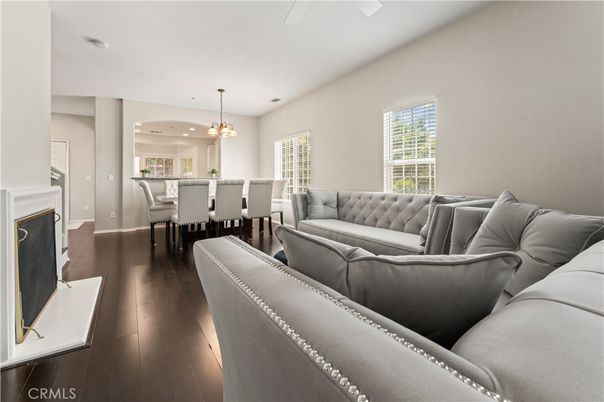 Chandelier, Dining room, Fireplace, Interior, Living room, Pendant Lights, Recessed Lighting, Wood Texture Flooring