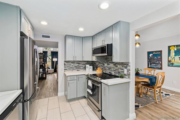 Dining room, Interior, Kitchen, Pendant Lights, Recessed Lighting, Stainless Steel Appliances, Wood Texture Flooring