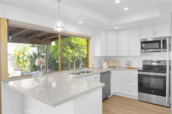Interior, Kitchen, Pendant Lights, Recessed Lighting, Stainless Steel Appliances, Wood Texture Flooring