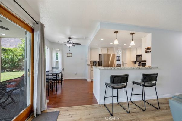 Dining room, Interior, Kitchen, Pendant Lights, Recessed Lighting, Stainless Steel Appliances, Wood Texture Flooring