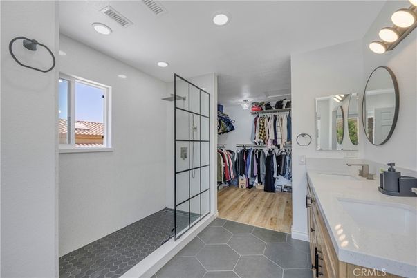 Bathroom, Dual Sink Vanities, Interior, Recessed Lighting, Walk-in Closets, Wood Texture Flooring
