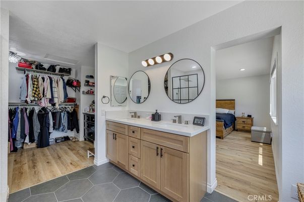 Bathroom, Dual Sink Vanities, Interior, Recessed Lighting, Walk-in Closets, Wood Texture Flooring