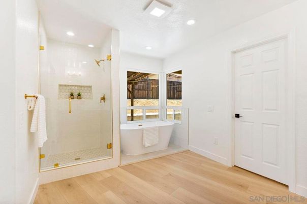 Bathroom, Free Standing Baths, Glass Shower, Interior, Recessed Lighting, Wood Texture Flooring