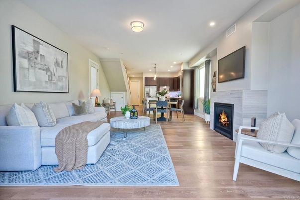 Dining room, Fireplace, Interior, Living room, Pendant Lights, Recessed Lighting, Wood Texture Flooring