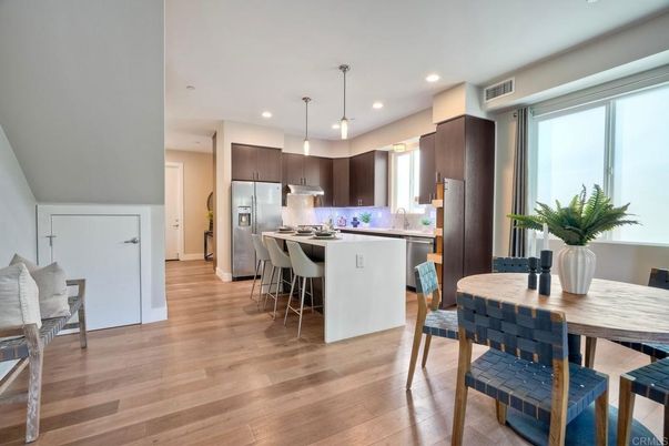 Dining room, Interior, Kitchen, Pendant Lights, Recessed Lighting, Stainless Steel Appliances, Wood Texture Flooring