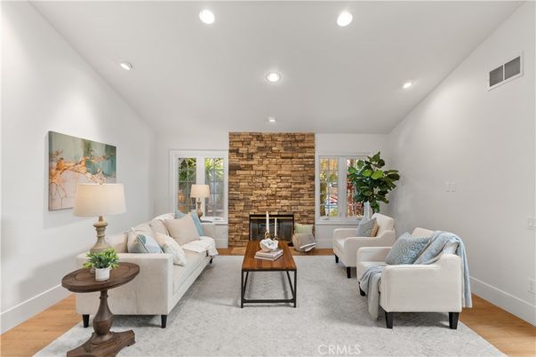 Fireplace, Interior, Living room, Recessed Lighting, Stone Walls, Wood Texture Flooring