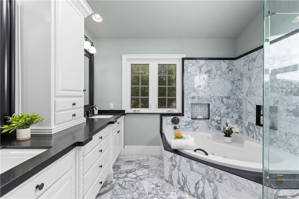Bathroom, Dual Sink Vanities, Glass Shower, Interior, Marble, Marble Walls, Recessed Lighting