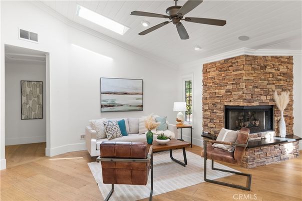 Fireplace, Interior, Living room, Recessed Lighting, Stone Walls, Wood Texture Flooring