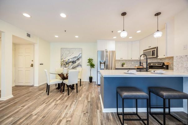 Dining room, Interior, Kitchen, Pendant Lights, Recessed Lighting, Stainless Steel Appliances, Wood Texture Flooring