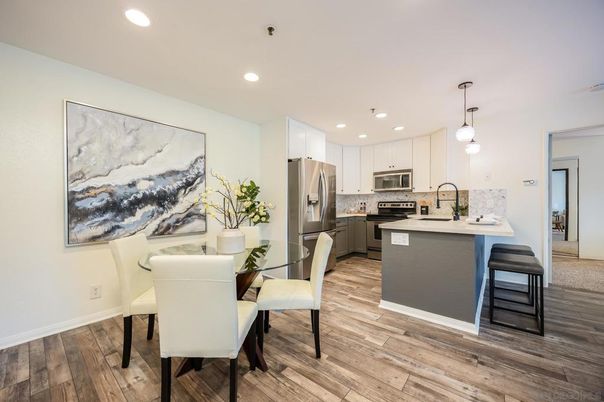 Dining room, Interior, Kitchen, Pendant Lights, Recessed Lighting, Stainless Steel Appliances, Wood Texture Flooring