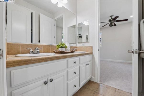 Bathroom, Dual Sink Vanities, Interior, Recessed Lighting, Tile Countertops