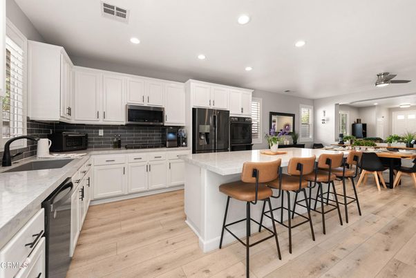 Dining room, Interior, Kitchen, Recessed Lighting, Stainless Steel Appliances, Wood Texture Flooring