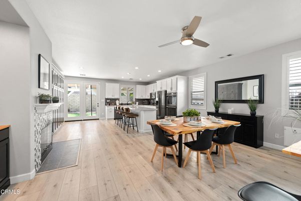 Dining room, Fireplace, Interior, Kitchen, Recessed Lighting, Stainless Steel Appliances, Wood Texture Flooring