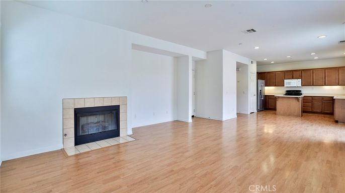 Empty room, Fireplace, Interior, Kitchen, Recessed Lighting, Wood Texture Flooring