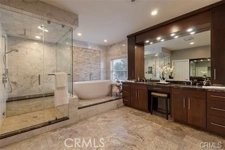 Bathroom, Dual Sink Vanities, Free Standing Baths, Glass Shower, Interior, Marble Walls, Recessed Lighting