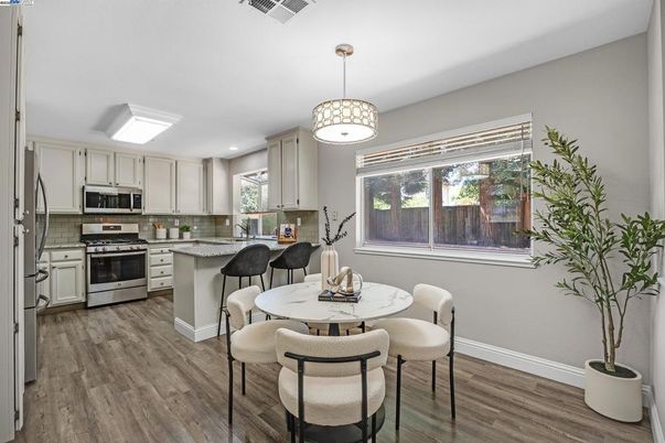 Dining room, Interior, Kitchen, Pendant Lights, Recessed Lighting, Stainless Steel Appliances, Wood Texture Flooring