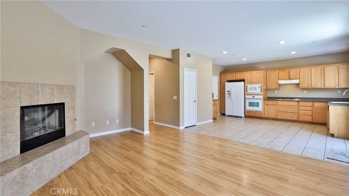 Empty room, Fireplace, Interior, Kitchen, Recessed Lighting, Wood Texture Flooring