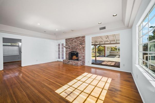 Empty room, Fireplace, Interior, Recessed Lighting, Stone Walls, Wood Texture Flooring