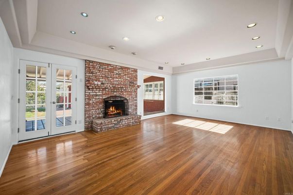 Empty room, Fireplace, Interior, Recessed Lighting, Stone Walls, Wood Texture Flooring