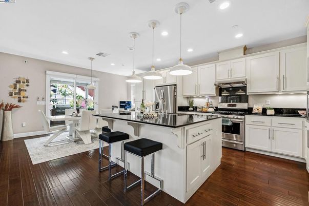 Dining room, Interior, Kitchen, Pendant Lights, Recessed Lighting, Stainless Steel Appliances, Wood Texture Flooring