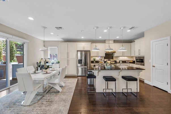 Dining room, Interior, Kitchen, Pendant Lights, Recessed Lighting, Stainless Steel Appliances, Wood Texture Flooring