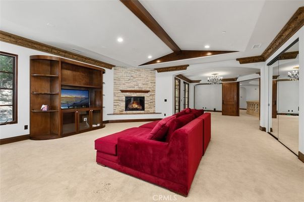 Chandelier, Fireplace, Interior, Living room, Recessed Lighting, Stone Walls, Wooden Beams