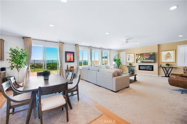 Dining room, Fireplace, Interior, Living room, Recessed Lighting, Wood Texture Flooring