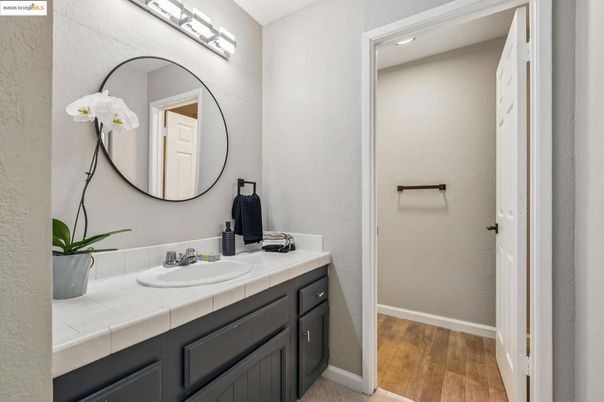 Bathroom, Interior, Recessed Lighting, Tile Countertops, Wood Texture Flooring