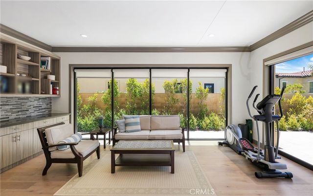 Fireplace, Fitness Equipment, Interior, Living room, Recessed Lighting, Wood Texture Flooring