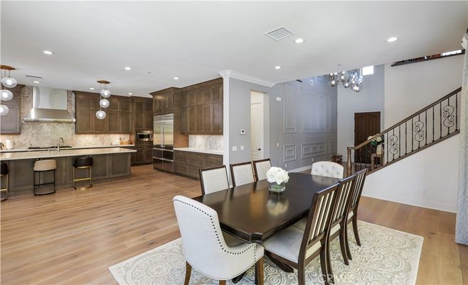 Chandelier, Dining room, Interior, Kitchen, Pendant Lights, Recessed Lighting, Stainless Steel Appliances, Wood Texture Flooring