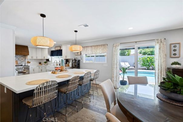 Dining room, Interior, Kitchen, Pendant Lights, Recessed Lighting, Stainless Steel Appliances, Wood Texture Flooring