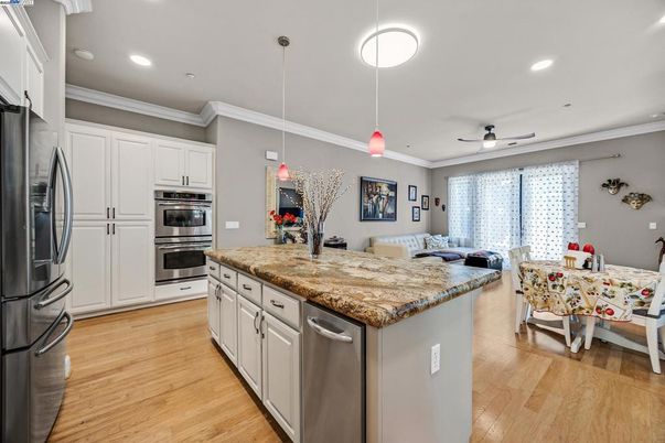 Dining room, Interior, Kitchen, Pendant Lights, Recessed Lighting, Stainless Steel Appliances, Wood Texture Flooring