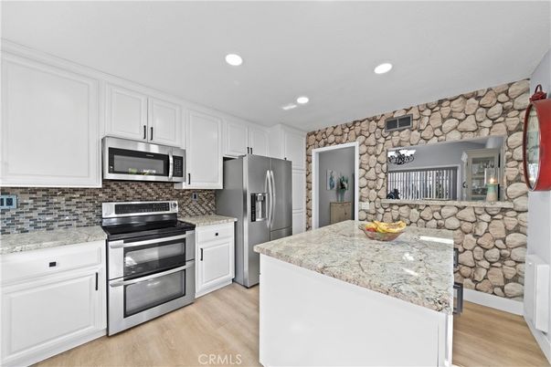 Interior, Kitchen, Recessed Lighting, Stainless Steel Appliances, Stone Walls, Wood Texture Flooring