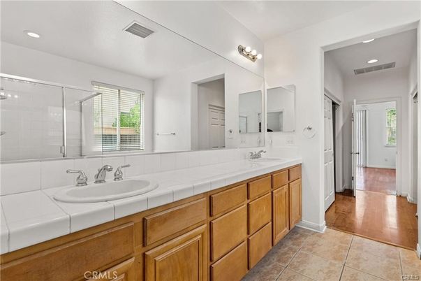 Bathroom, Dual Sink Vanities, Glass Shower, Interior, Recessed Lighting, Tile Countertops