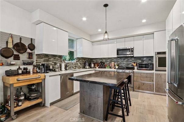 Interior, Kitchen, Pendant Lights, Recessed Lighting, Stainless Steel Appliances, Wood Texture Flooring