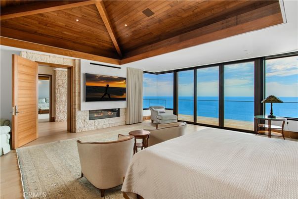 Bedroom, Fireplace, Interior, Living room, Recessed Lighting, Water, Wooden Beams, Wooden Ceilings, Wood Texture Flooring