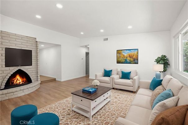 Fireplace, Interior, Living room, Recessed Lighting, Stone Walls, Wood Texture Flooring