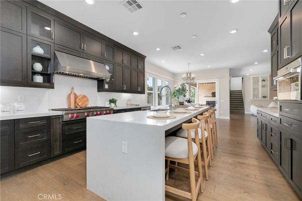 Chandelier, Interior, Kitchen, Recessed Lighting, Stainless Steel Appliances, Wood Texture Flooring
