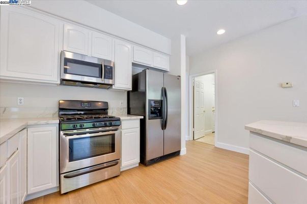 Interior, Kitchen, Recessed Lighting, Stainless Steel Appliances, Wood Texture Flooring