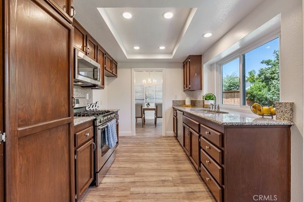 Chandelier, Interior, Kitchen, Recessed Lighting, Stainless Steel Appliances, Wood Texture Flooring