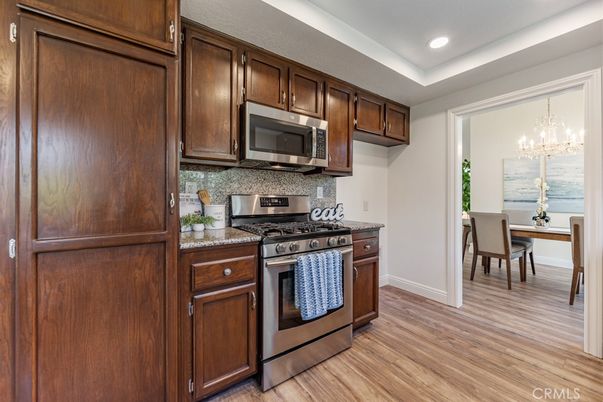 Chandelier, Dining room, Interior, Kitchen, Recessed Lighting, Stainless Steel Appliances, Wood Texture Flooring