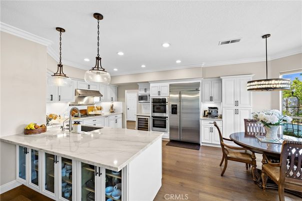 Dining room, Interior, Kitchen, Pendant Lights, Recessed Lighting, Stainless Steel Appliances, Wood Texture Flooring