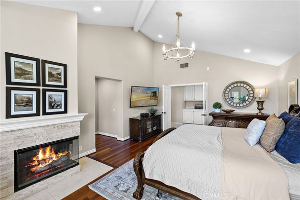 Bedroom, Chandelier, Fireplace, Interior, Pendant Lights, Recessed Lighting, Wood Texture Flooring