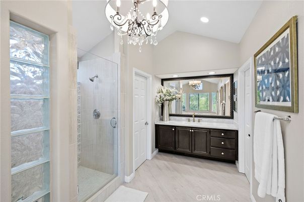 Bathroom, Chandelier, Glass Shower, Interior, Recessed Lighting, Wood Texture Flooring