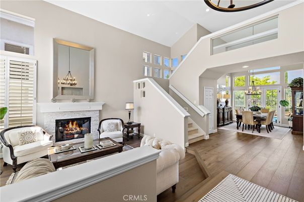 Chandelier, Dining room, Fireplace, Interior, Living room, Pendant Lights, Recessed Lighting, Wood Texture Flooring
