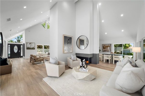Dining room, Fireplace, Interior, Living room, Recessed Lighting, Wood Texture Flooring