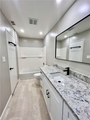 Bathroom, Dual Sink Vanities, Interior, Recessed Lighting, Wood Texture Flooring
