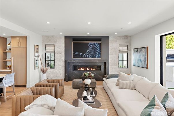 Fireplace, Interior, Living room, Recessed Lighting, Stone Walls, Wood Texture Flooring