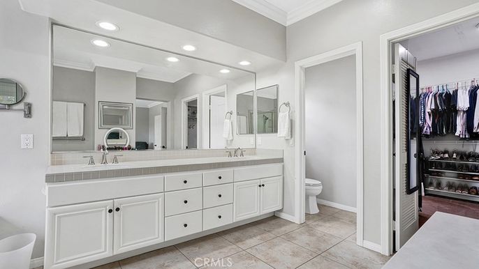 Bathroom, Dual Sink Vanities, Interior, Recessed Lighting, Tile Countertops, Walk-in Closets